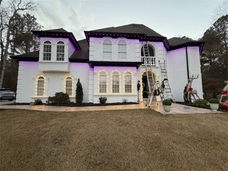 Permanent outdoor lighting installed along a premium home roofline