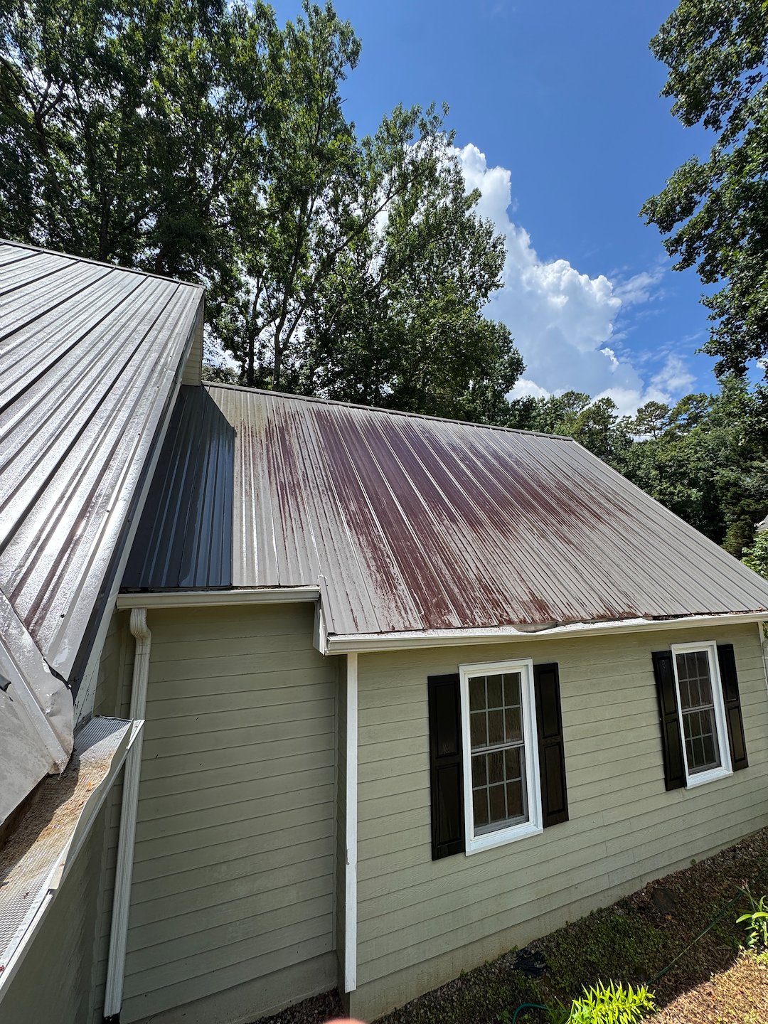 Metal Roof Cleaning in Hoschton GA to Remove Organic Growth and Restore Curb Appeal Thumbnail